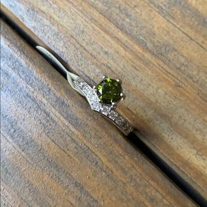 Ring with green center stone